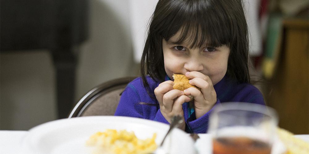 Five-year-old Mojave enjoys Feeding the Spirit’s dinner at Otterbein United Methodist Church.