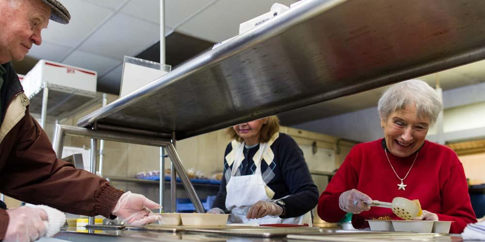 At Tri-City Meals on Wheels, a team of mostly volunteers gathers every morning to make as many as 190 meals for the elderly in the region.