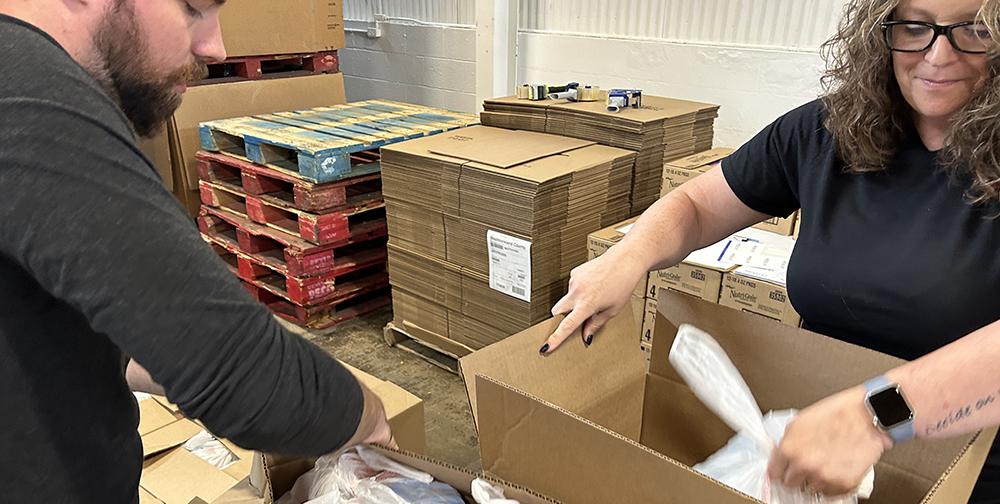 Westmoreland Food Bank volunteers unpacking boxes that will provide food  to those in need across Westmoreland County. 
